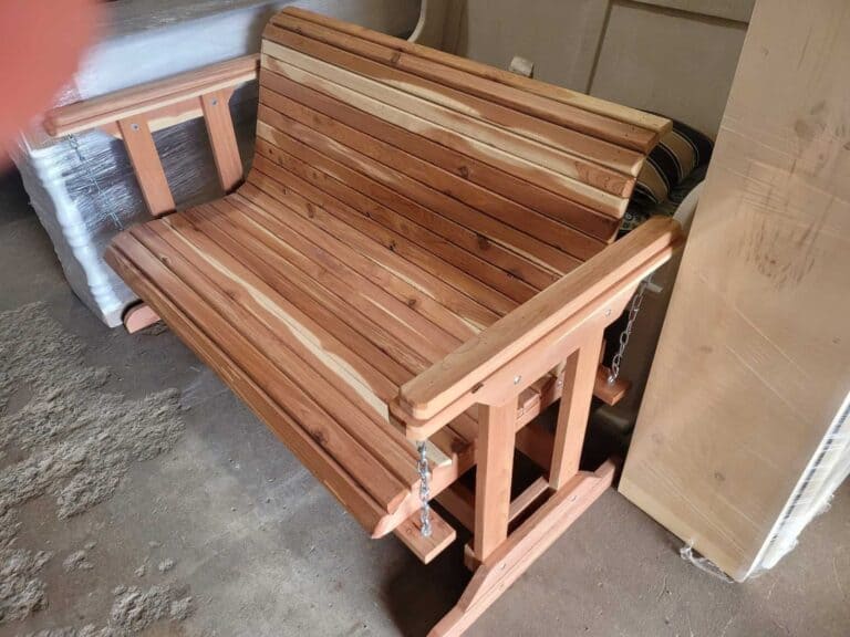 Handcrafted cedar porch swing for outdoor relaxation from Athens Woodcrafters.