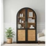 Elegant arched bookcase with black frame and natural wood shelves and drawers.
