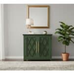 Elegant green cabinet with gold handles in modern living space.