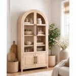 Natural wood cabinet with glass doors and 4 drawers in a cozy living room.