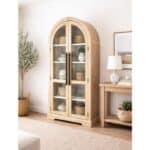 Elegant arched glass cabinet with wooden frame and shelves for display.