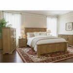 Elegant bedroom with wooden furniture and white bedding in a bright room.