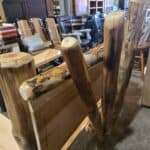 Rustic Amish log bench made from natural wood logs for outdoor or indoor use.