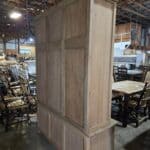 Wooden mud room cabinet with storage and coat rack in rustic style.