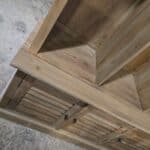 Wooden mud room cabinet with storage and coat rack features.