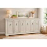 Elegant white media console with six doors and decorative handles in a cozy living room.