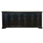 Black media console with six doors and gold ring pulls for stylish storage.