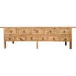 Natural wood buffet with multiple drawers and ring pulls, rustic style furniture.