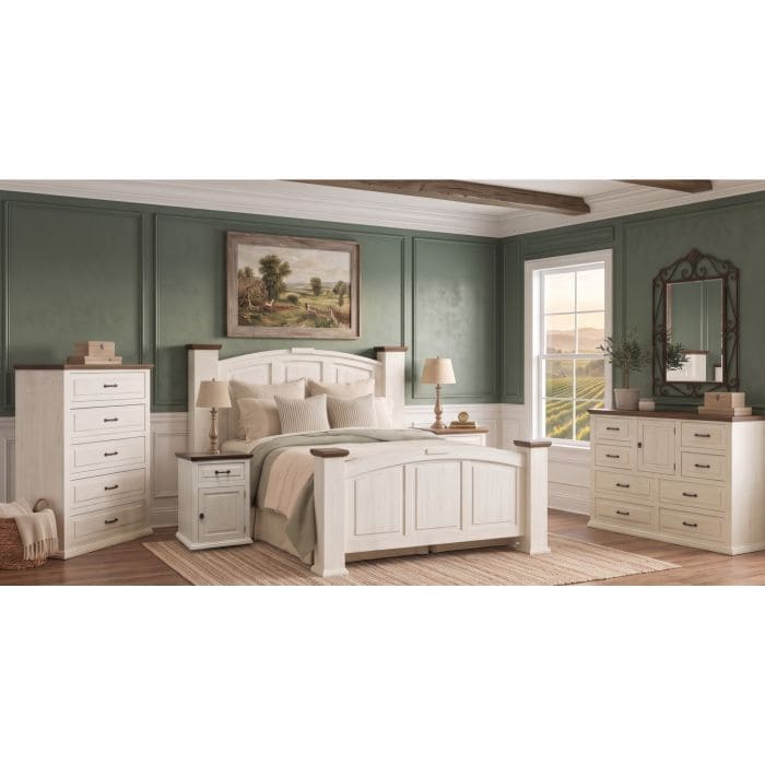 Elegant white bedroom furniture set with dresser, nightstands, and mirror in a cozy room.